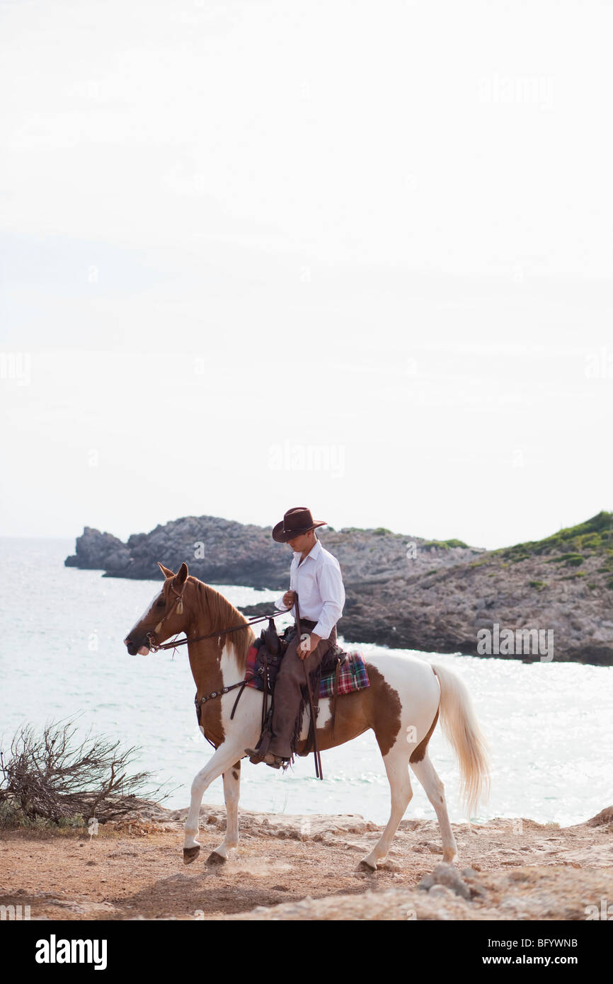 Uomo di equitazione Foto Stock