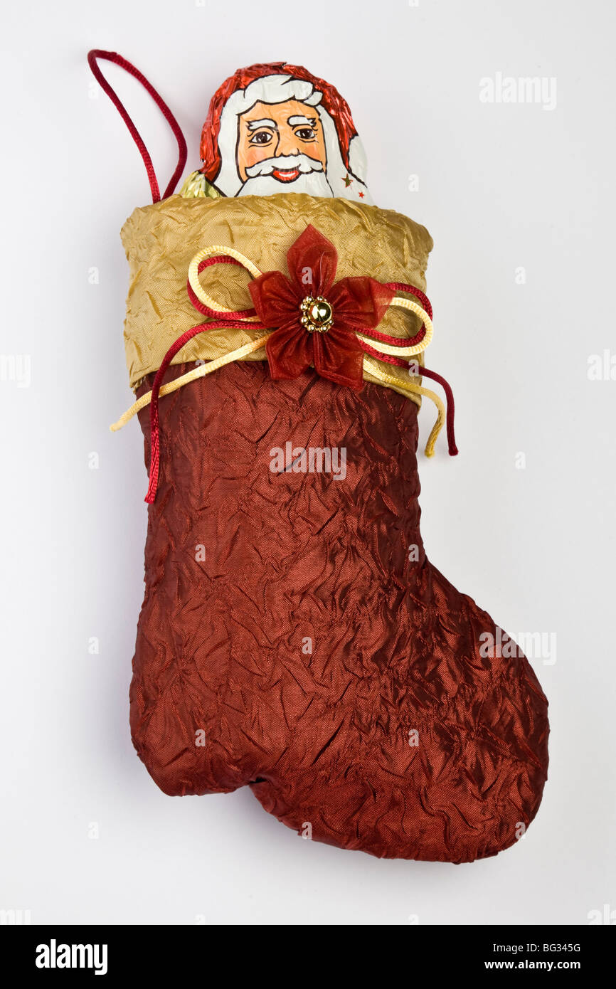 Una cioccolata Babbo Natale in un calzino di Natale Foto Stock