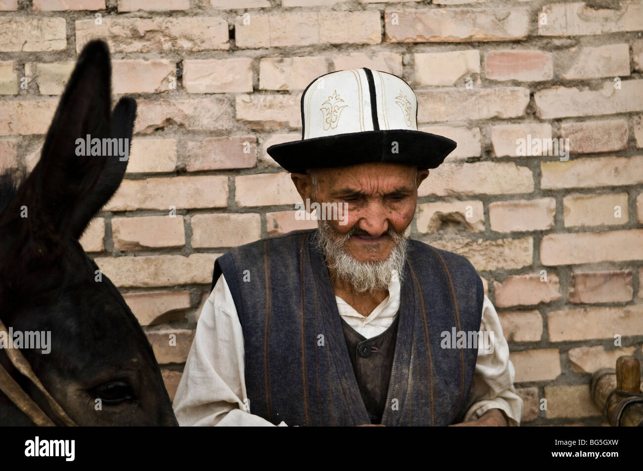 Un Kyrigz l uomo e la sua doneky. Foto Stock