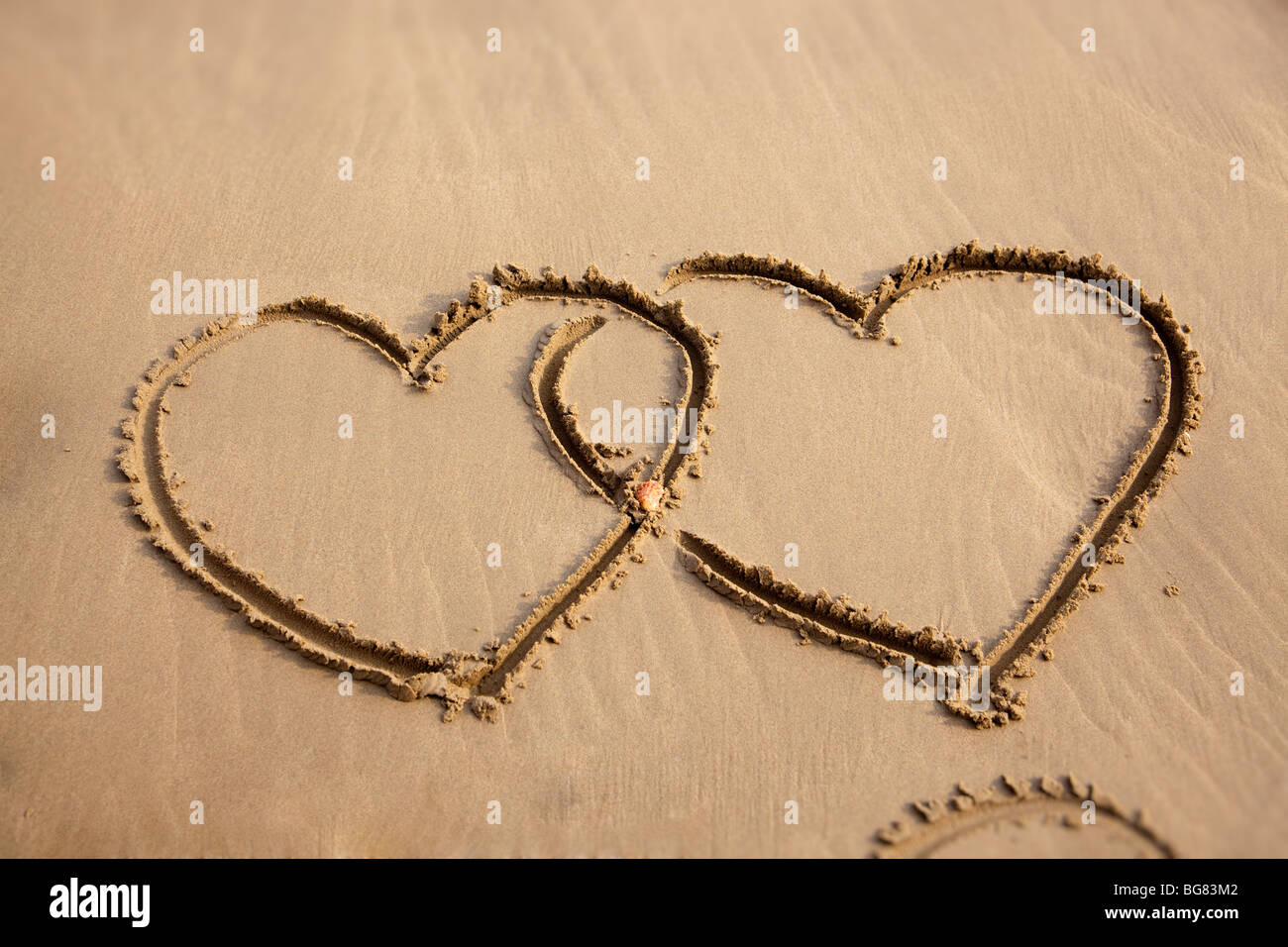 Due cuori in spiaggia Foto Stock