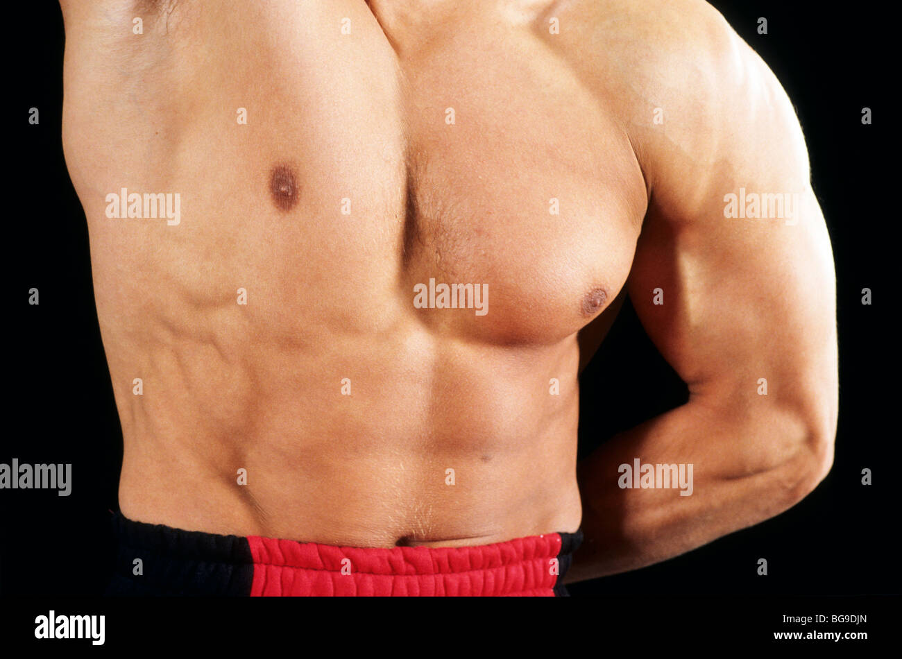 Close up di un body builders corpo muscoloso Foto Stock