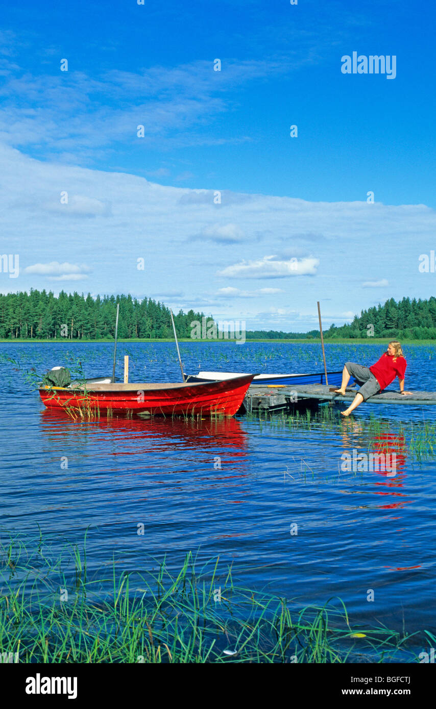 Barche a remi, sul lago Siljan vicino Utanmyra, Svezia centrale Foto Stock