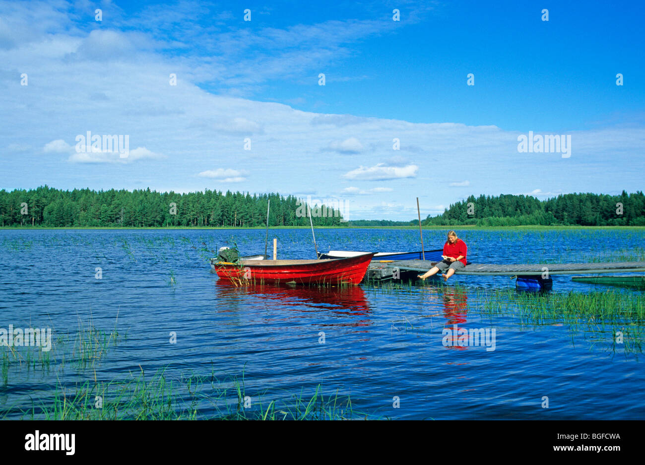Barche a remi, sul lago Siljan vicino Utanmyra, Svezia centrale Foto Stock