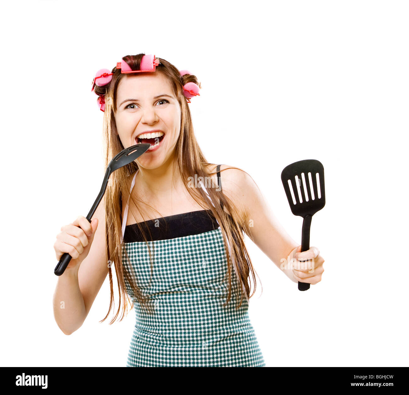 Ritratto di crazy casalinga con utensili da cucina Foto Stock
