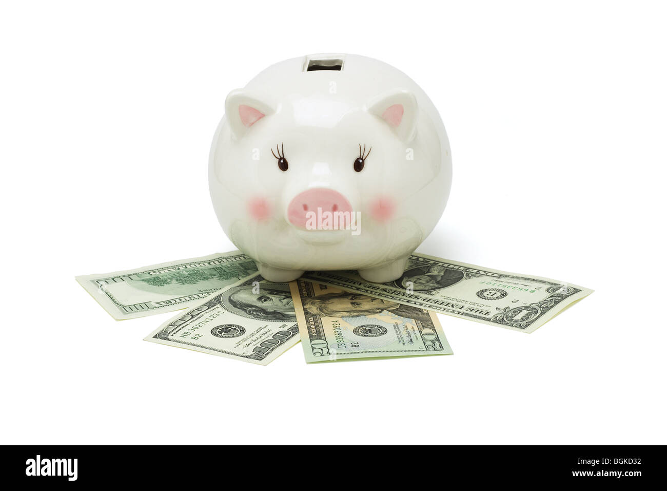 Salvadanaio e dollari USA su sfondo bianco Foto Stock