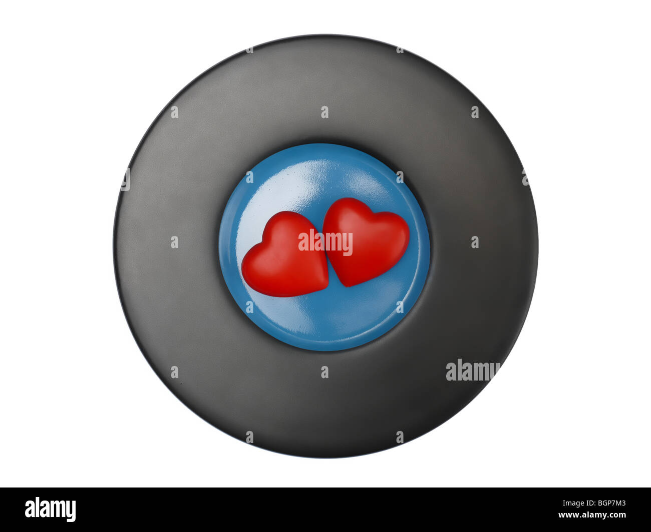 Due cuori rosso su nero e lastra blu su sfondo bianco Foto Stock