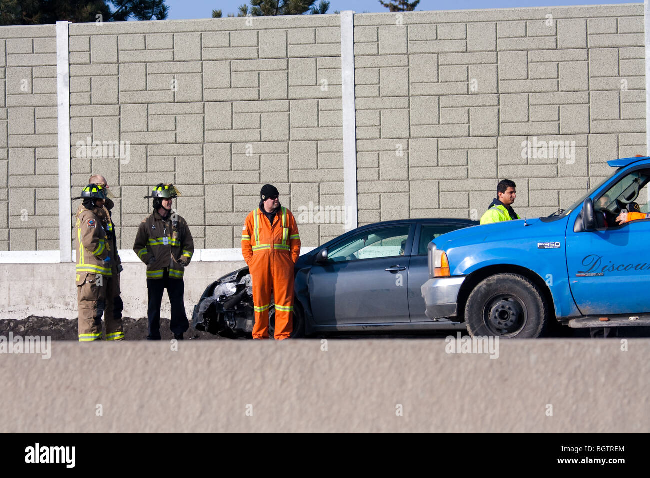 Incidente di auto fireman 'carroattrezzi' Foto Stock
