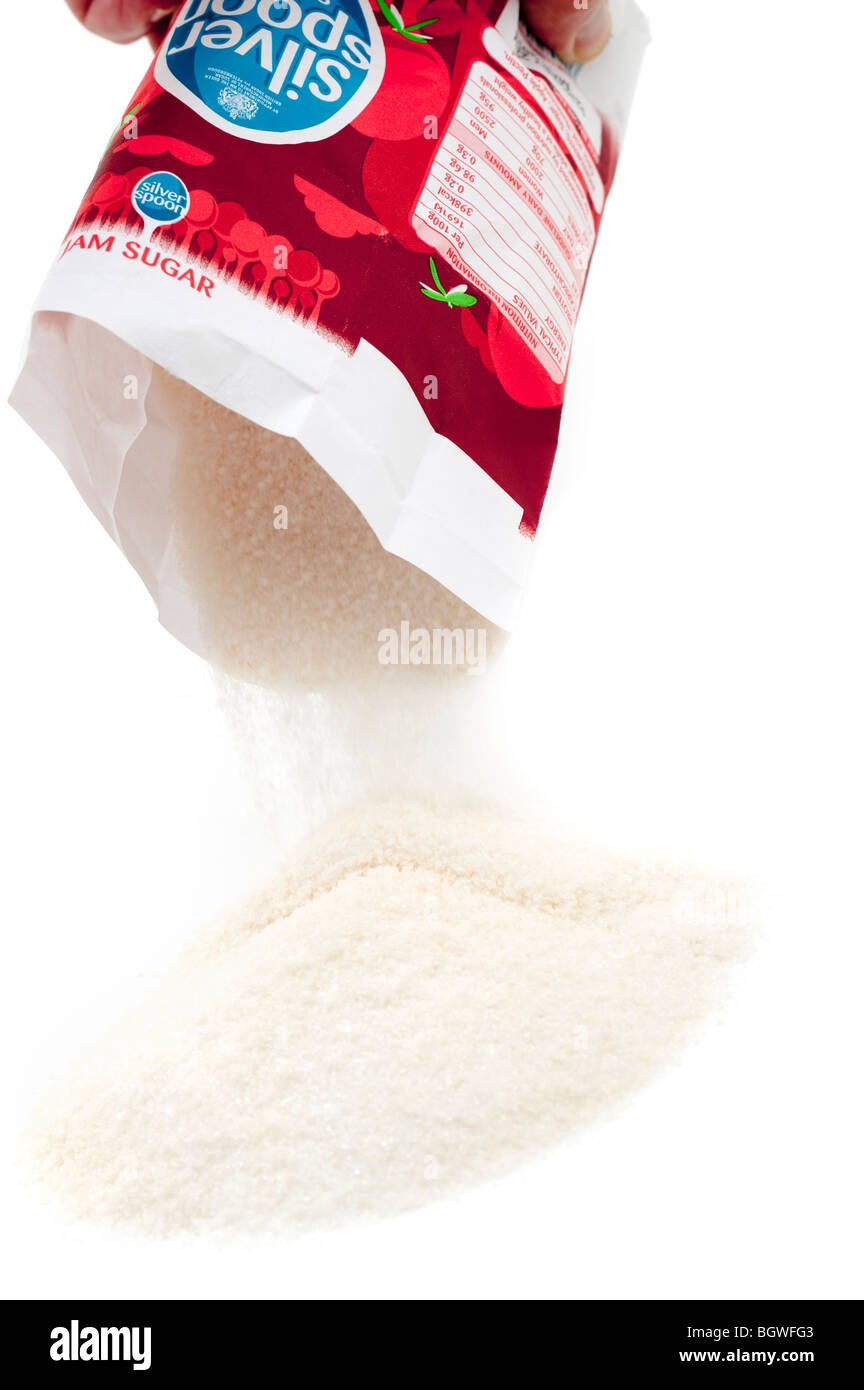 Borsa di inceppamento sversamento di zucchero su una superficie bianca Foto Stock