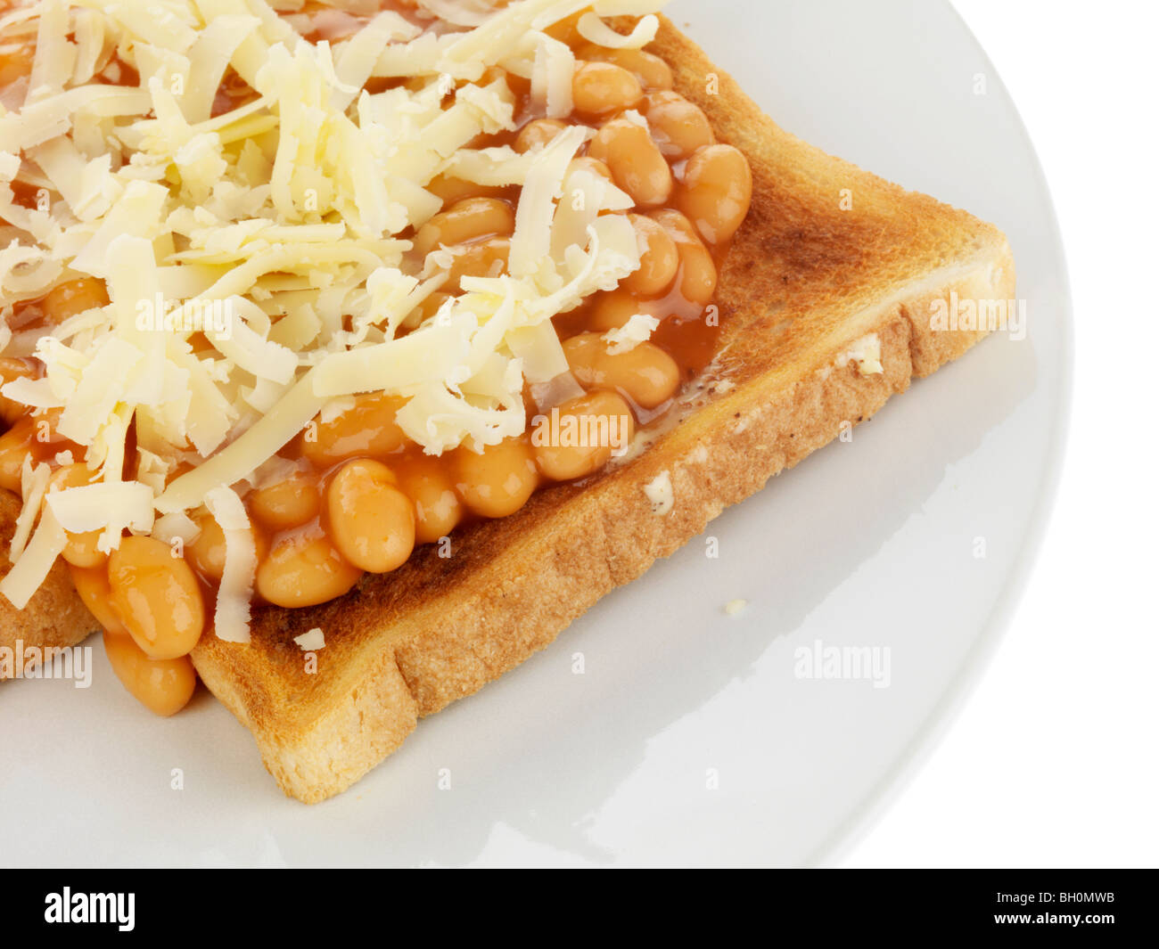 Cheesy fagioli su pane tostato Foto Stock