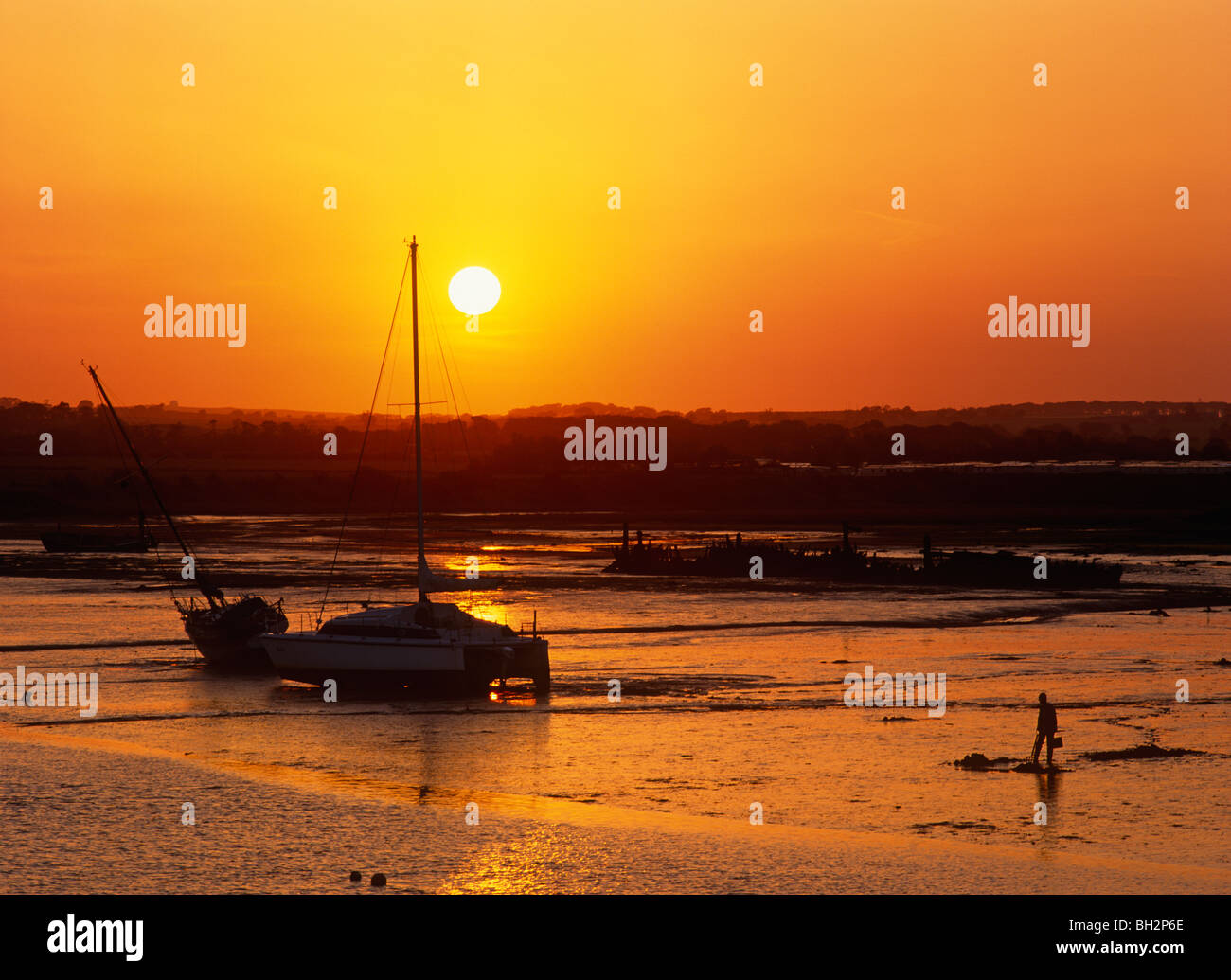 Un tramonto sul porto di camminare in Northumberland Foto Stock