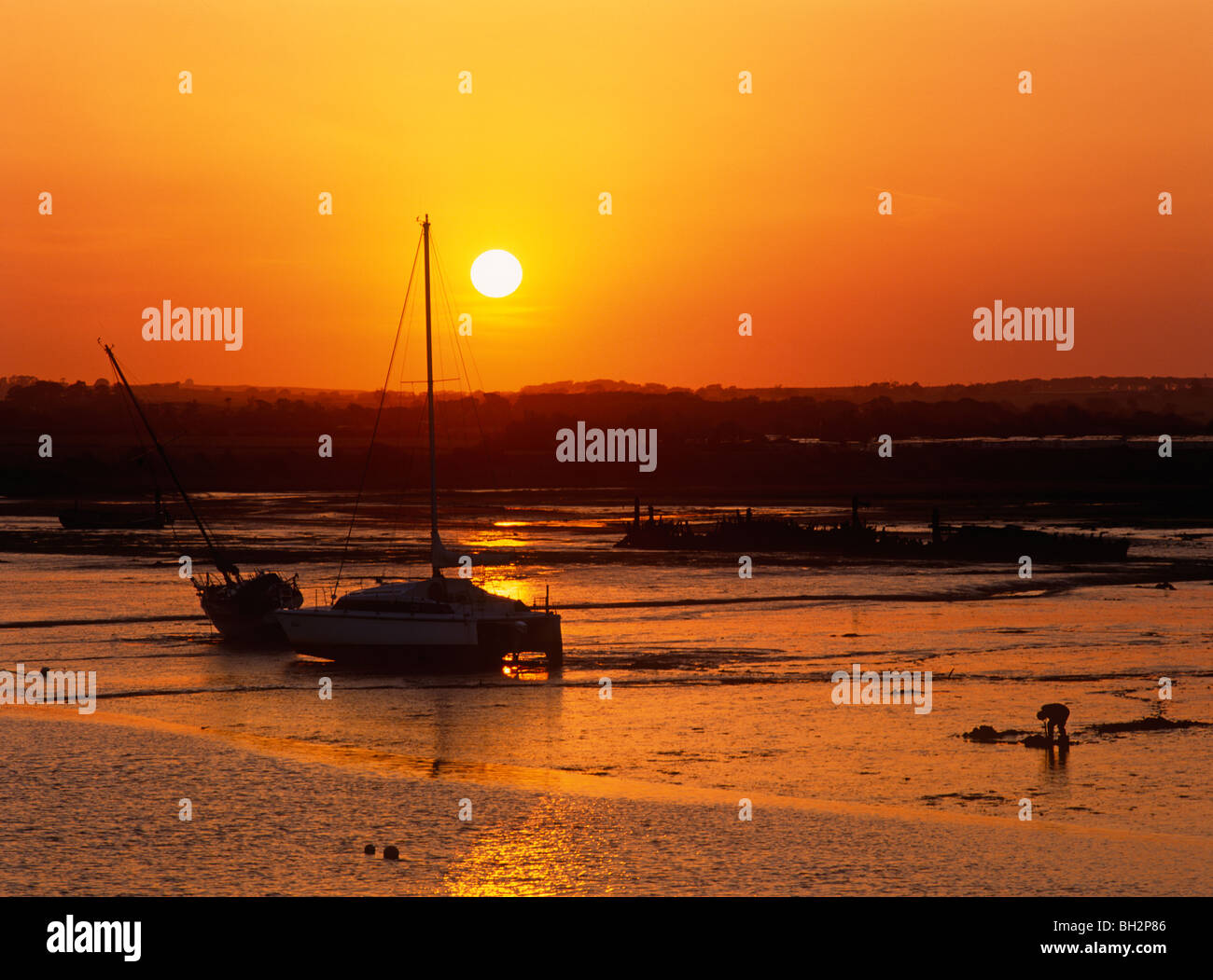 Un tramonto sul porto di camminare in Northumberland Foto Stock