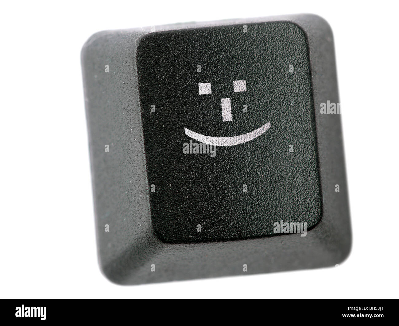 Tastiera nera tasto con l'icona smile isolato su bianco Foto Stock