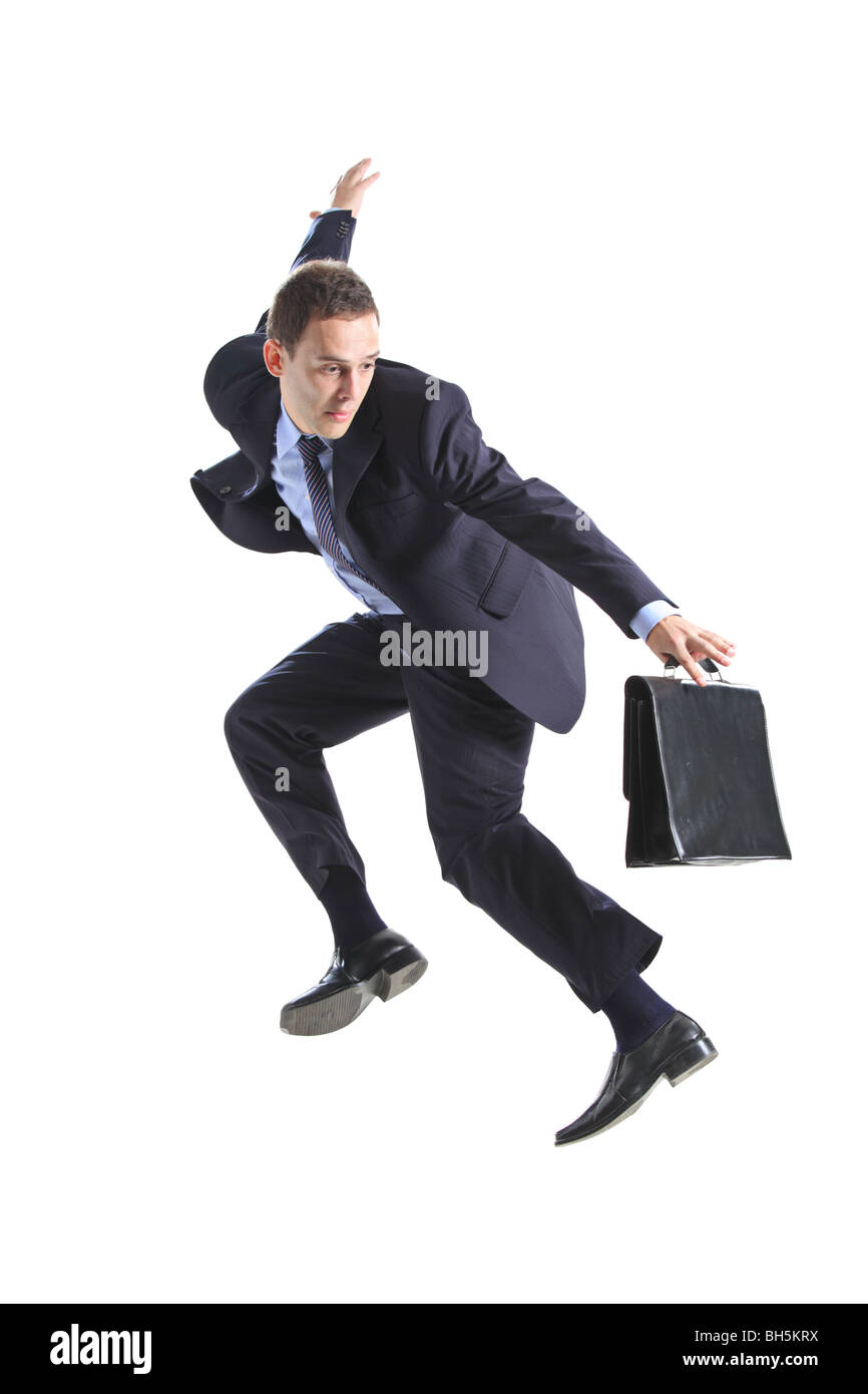 Un felice giovane imprenditore del salto in aria isolata su sfondo bianco Foto Stock