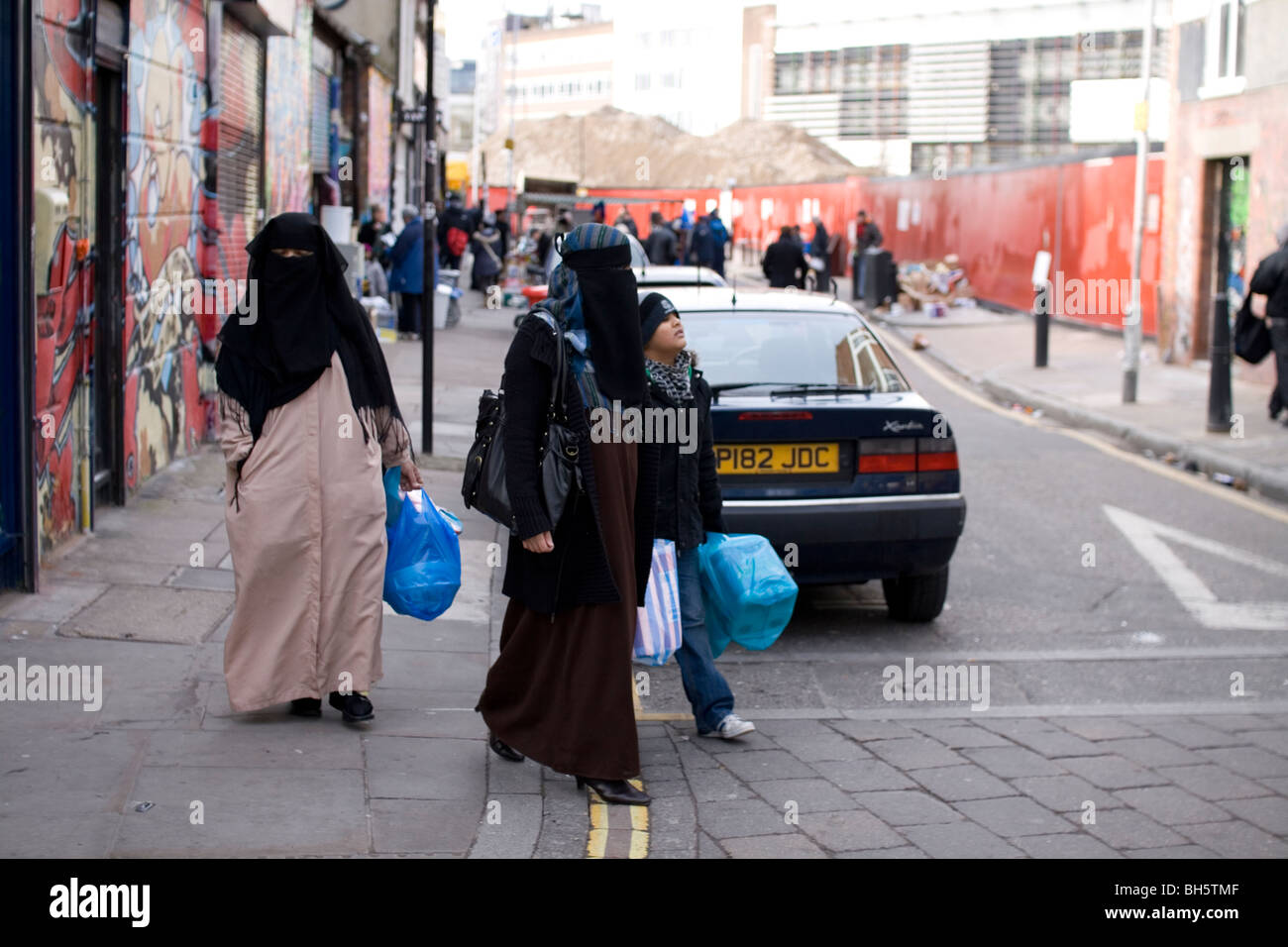 I musulmani in Brick Lane, a est di Londra. Foto Stock