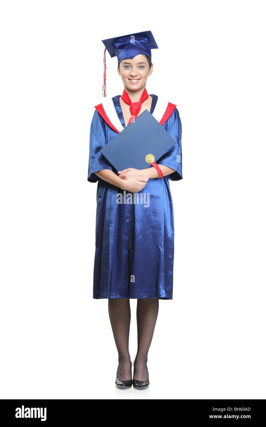 Studente con un abito di graduazione in posa, isolato su sfondo bianco Foto Stock