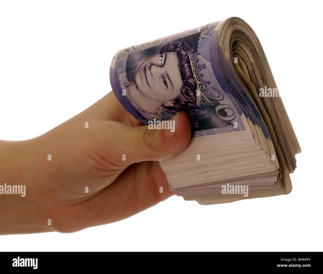 Uomo con un rotolo di venti pound note Foto Stock