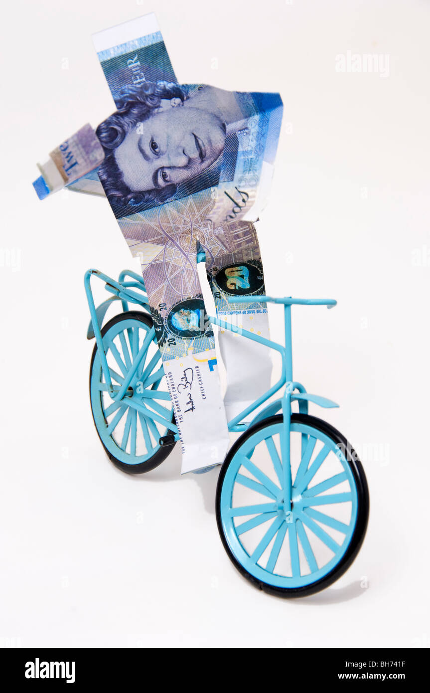 Concetto finanziario British pound riding bike felice moneta forte Foto Stock