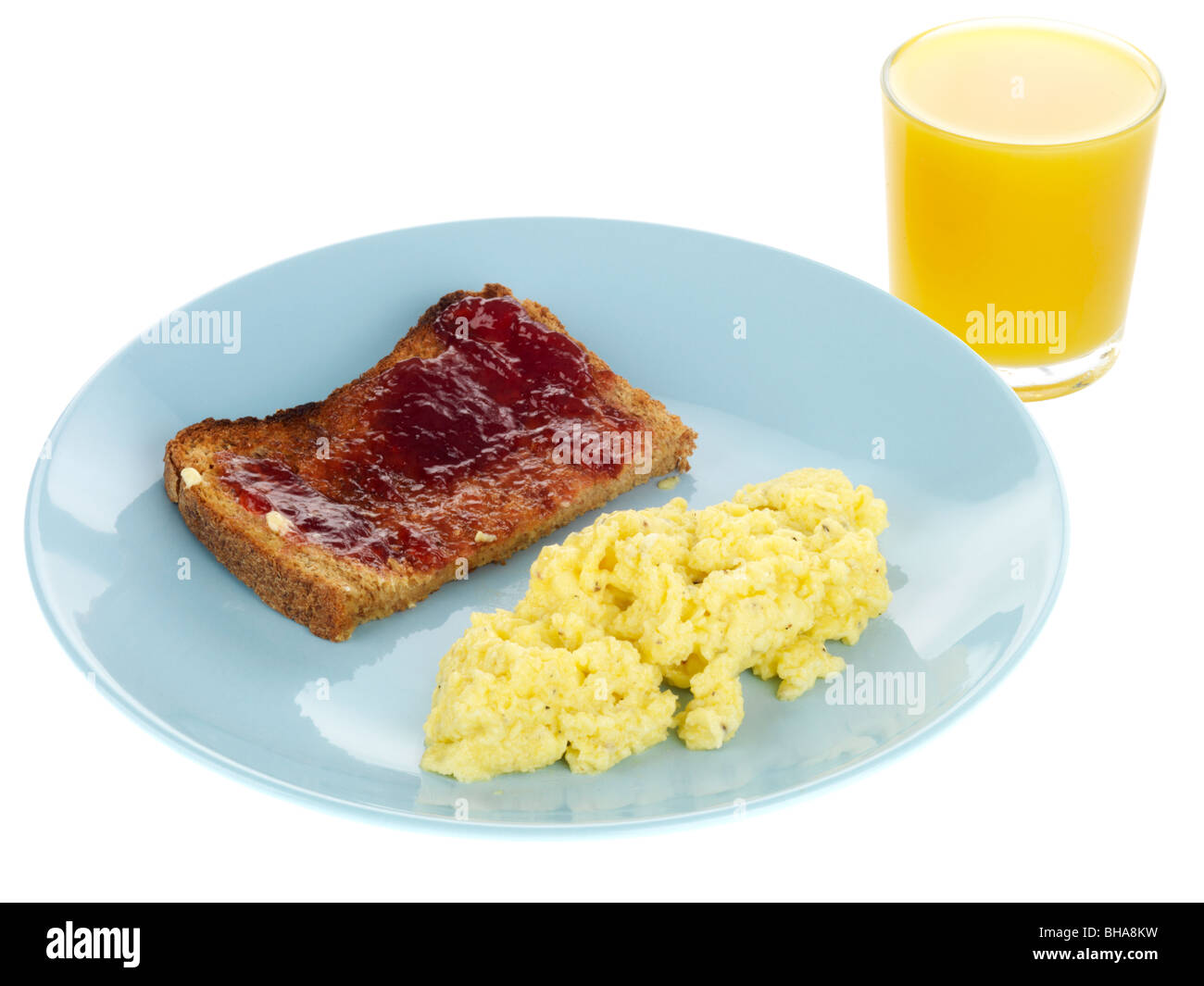 Uova strapazzate con marmellata sul pane tostato Foto Stock
