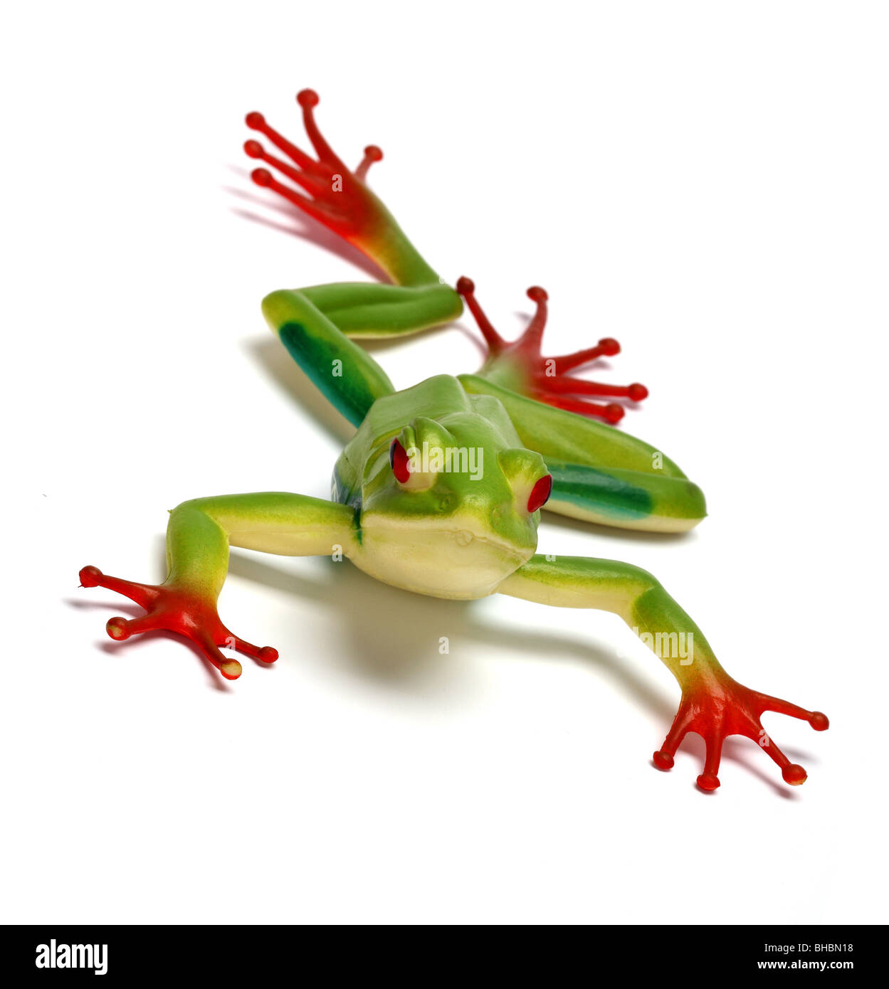Frog giocattolo di plastica animale selvatico colorato zampe lunghe cat long tail predator bambini gioco fingere icona grafica iconica Foto Stock