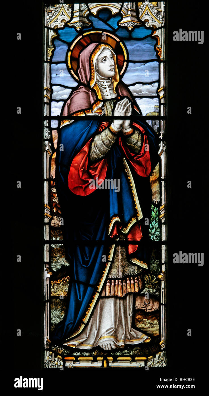 Una vetrata raffigurante la Vergine Maria alla crocifissione di Cristo, sulla Chiesa Silton, North Yorkshire Foto Stock