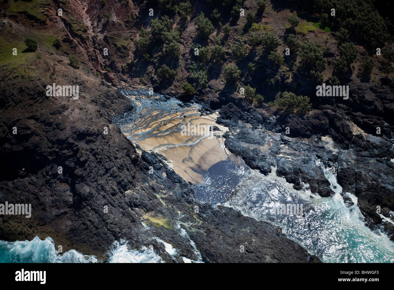Fuoriuscita di olio lavaggio fino sul litorale Moreton Island Queensland Australia Foto Stock