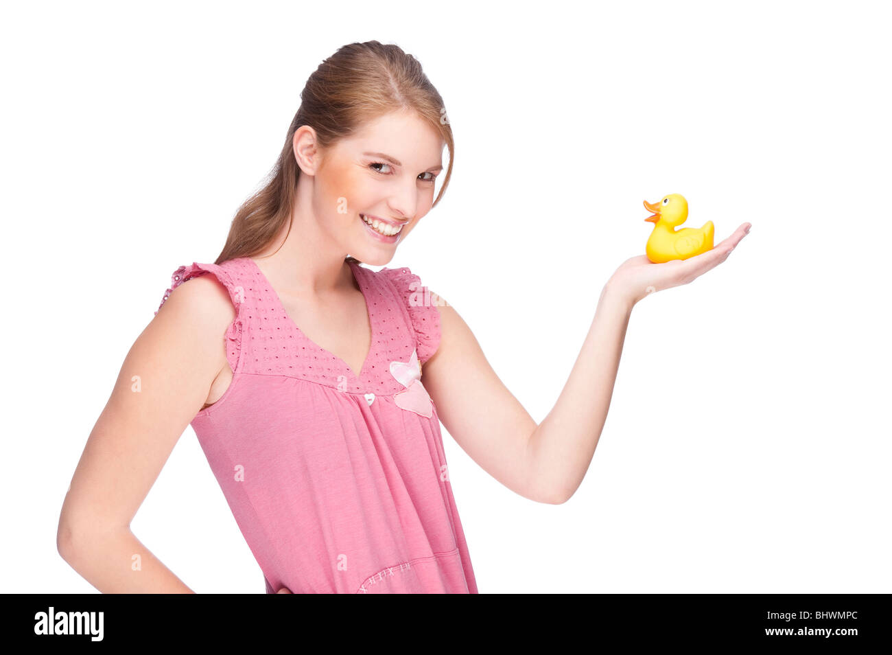 Piena isolati studio immagine da una giovane donna con gomma gialla duck Foto Stock