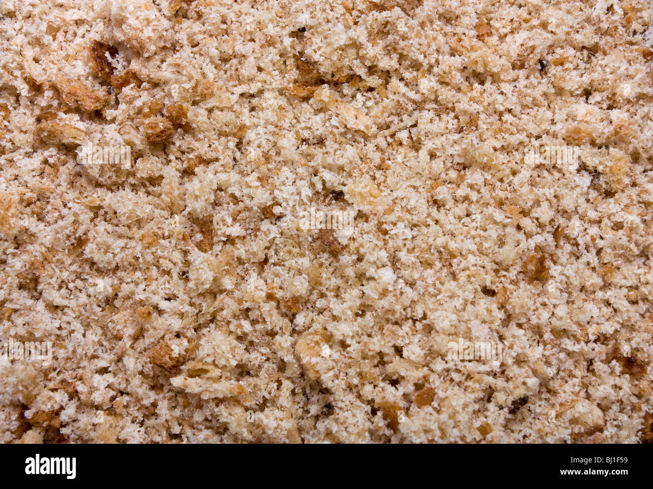 Background / texture di pangrattato dal marrone pagnotte di pane. Foto Stock