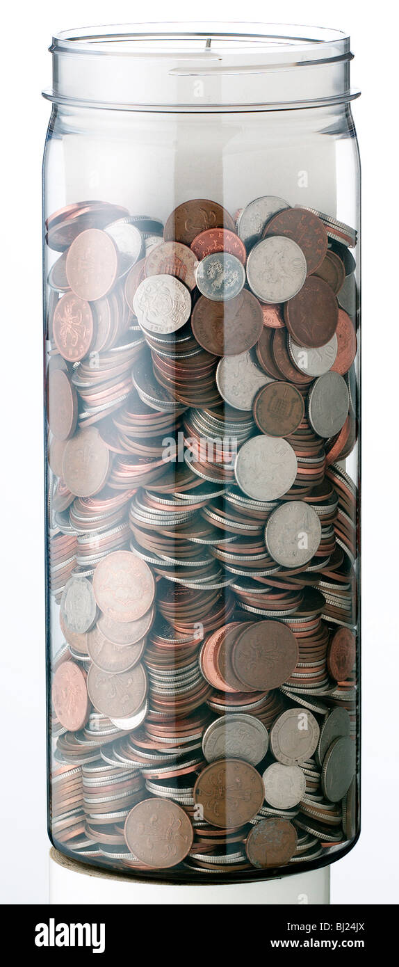 Monete in un vaso Foto Stock