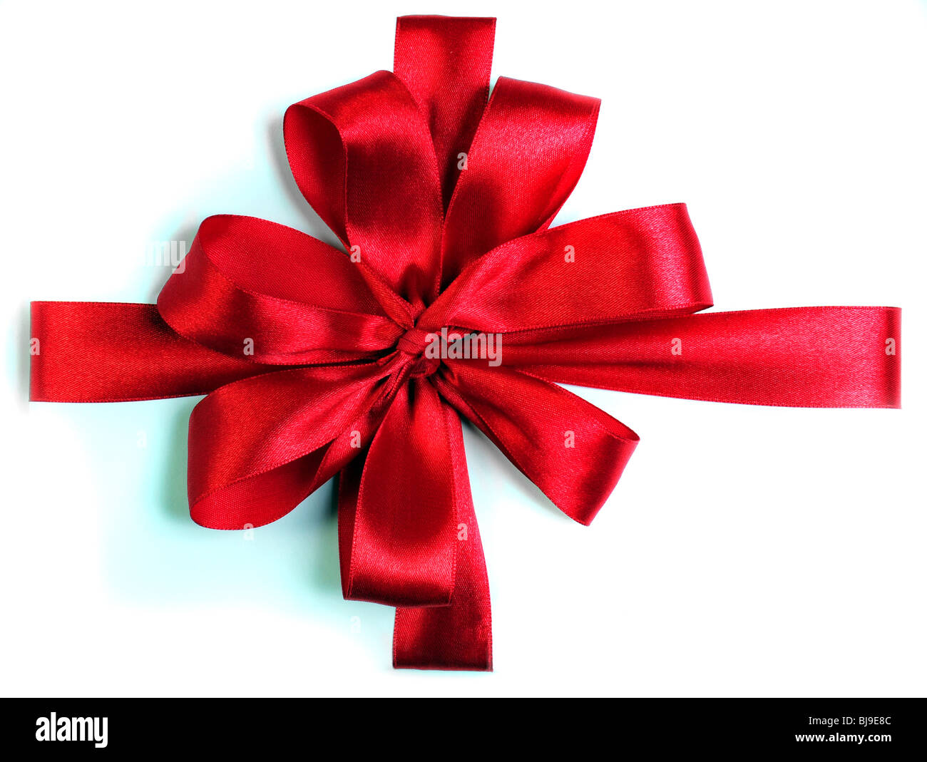 Red Ribbon bow su sfondo bianco Foto Stock