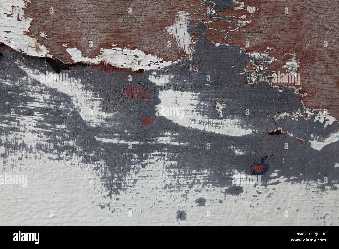Astratti modelli di vernice sullo scafo di una barca prima di essere re-verniciato. Foto Stock