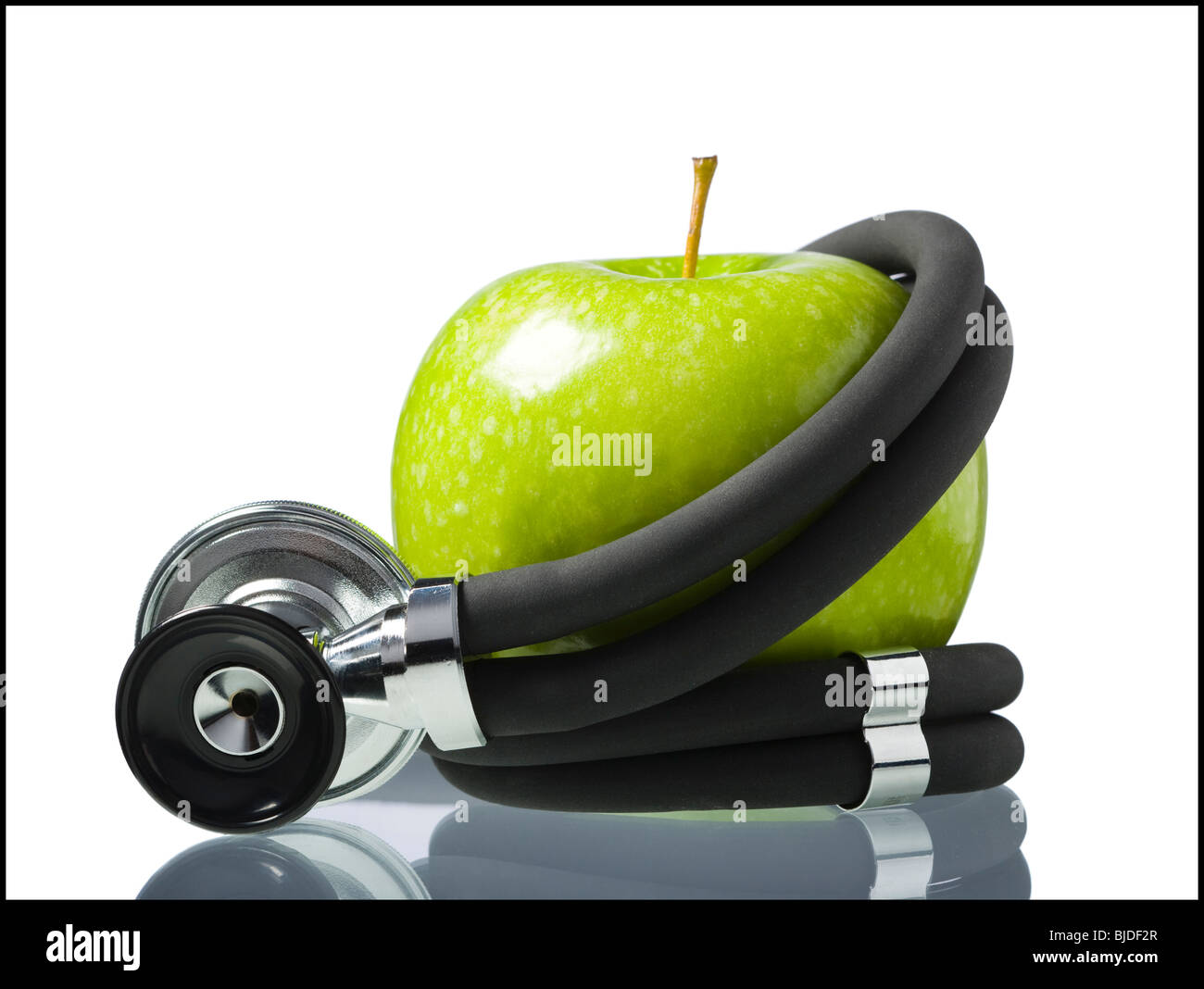 Apple avvolto in un stethopscope. Foto Stock