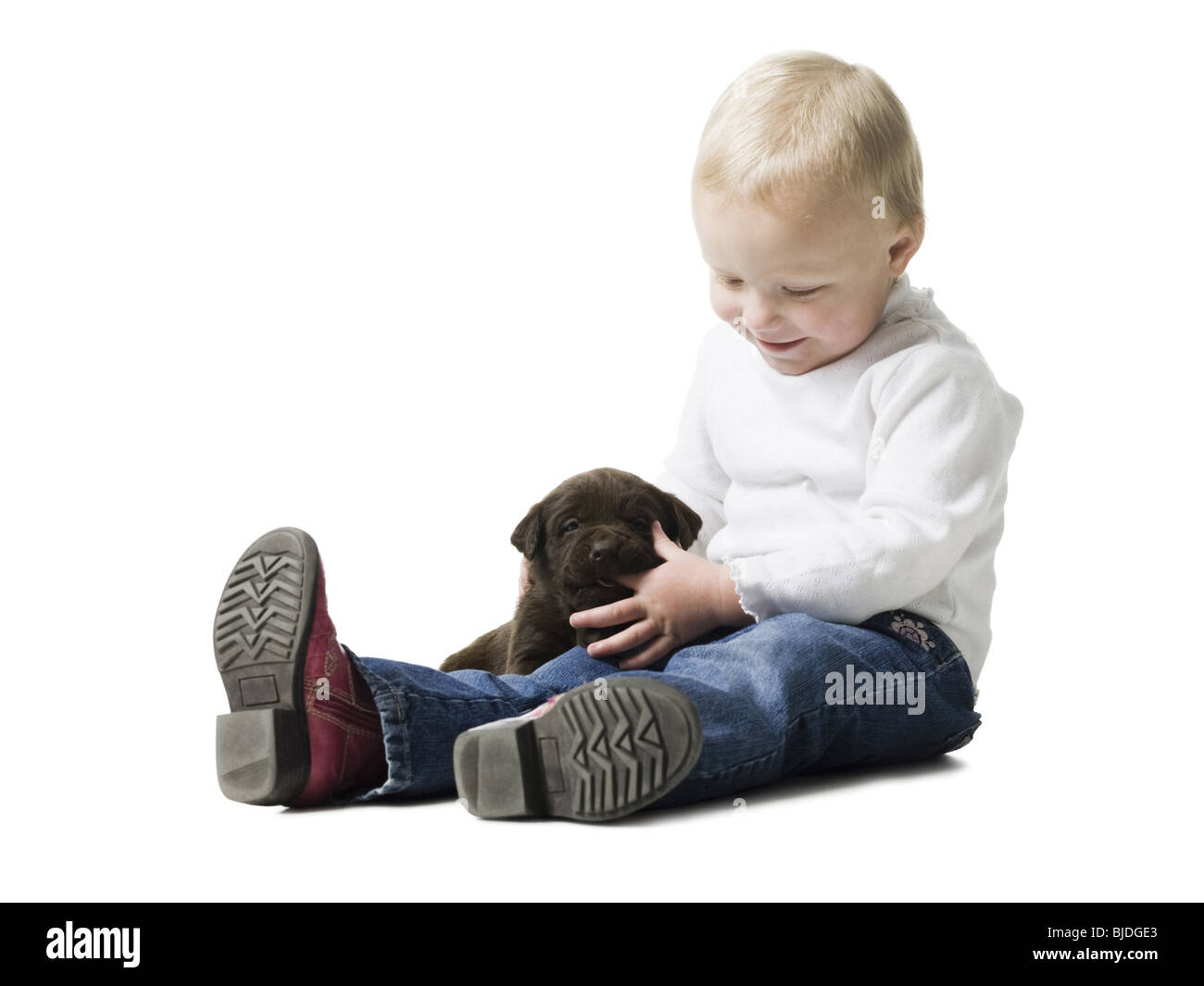 Bambino con cucciolo Foto Stock