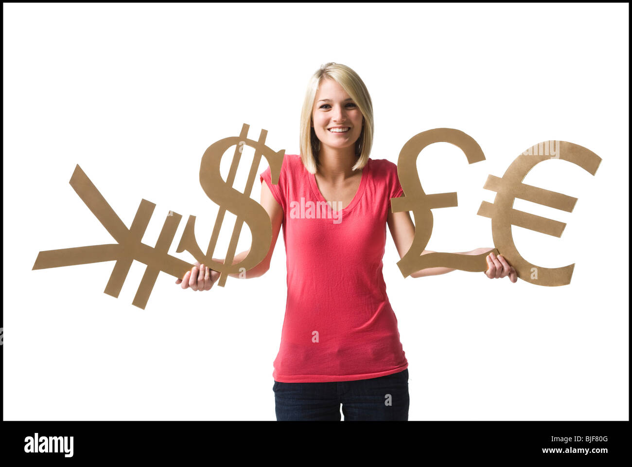 Donna che mantiene i simboli di valuta Foto Stock