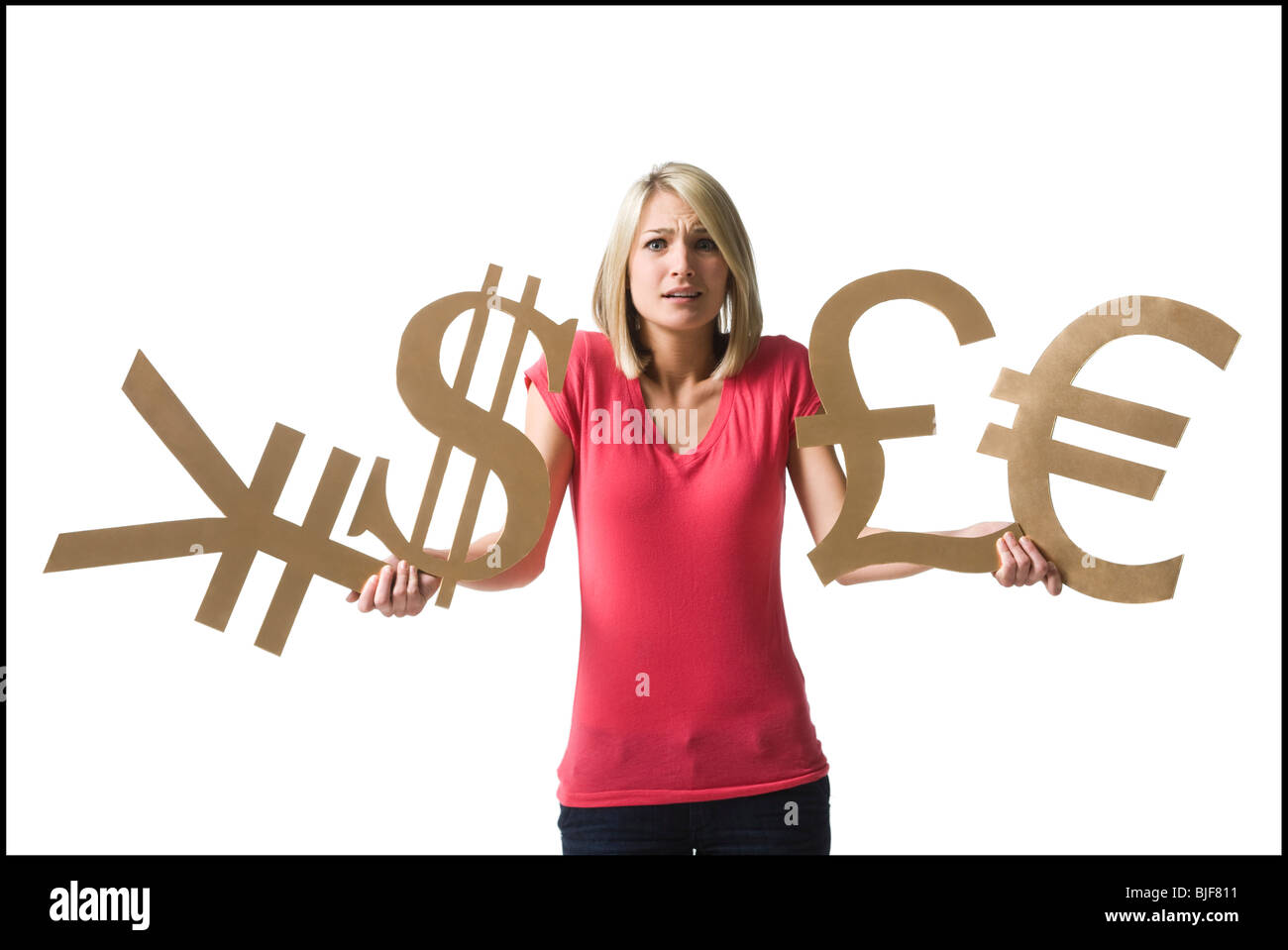 Donna che mantiene i simboli di valuta Foto Stock