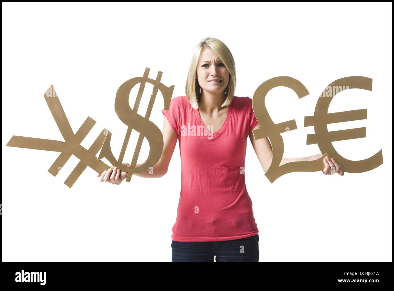 Donna che mantiene i simboli di valuta Foto Stock