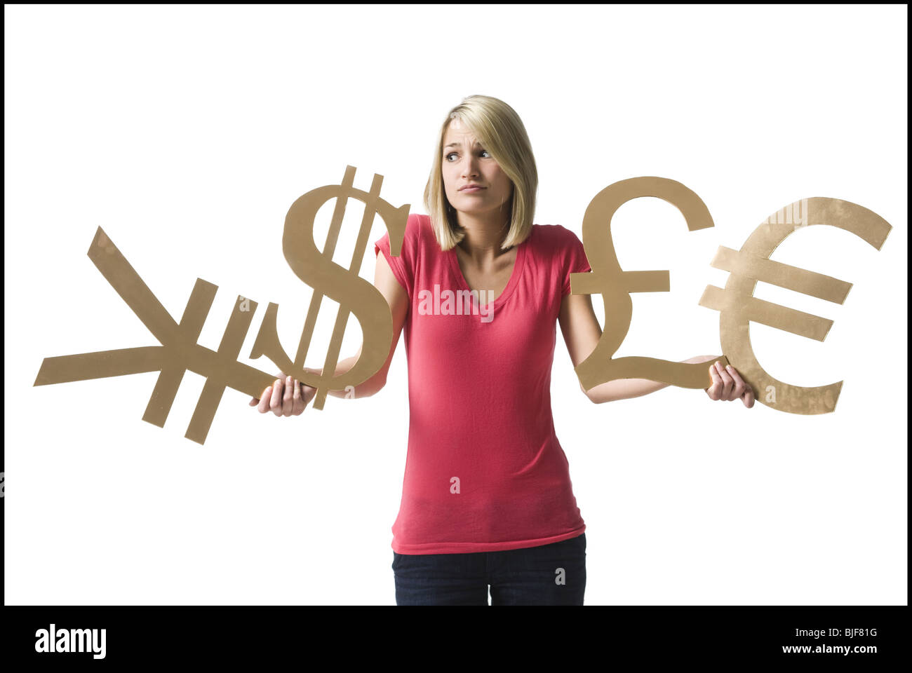 Donna che mantiene i simboli di valuta Foto Stock