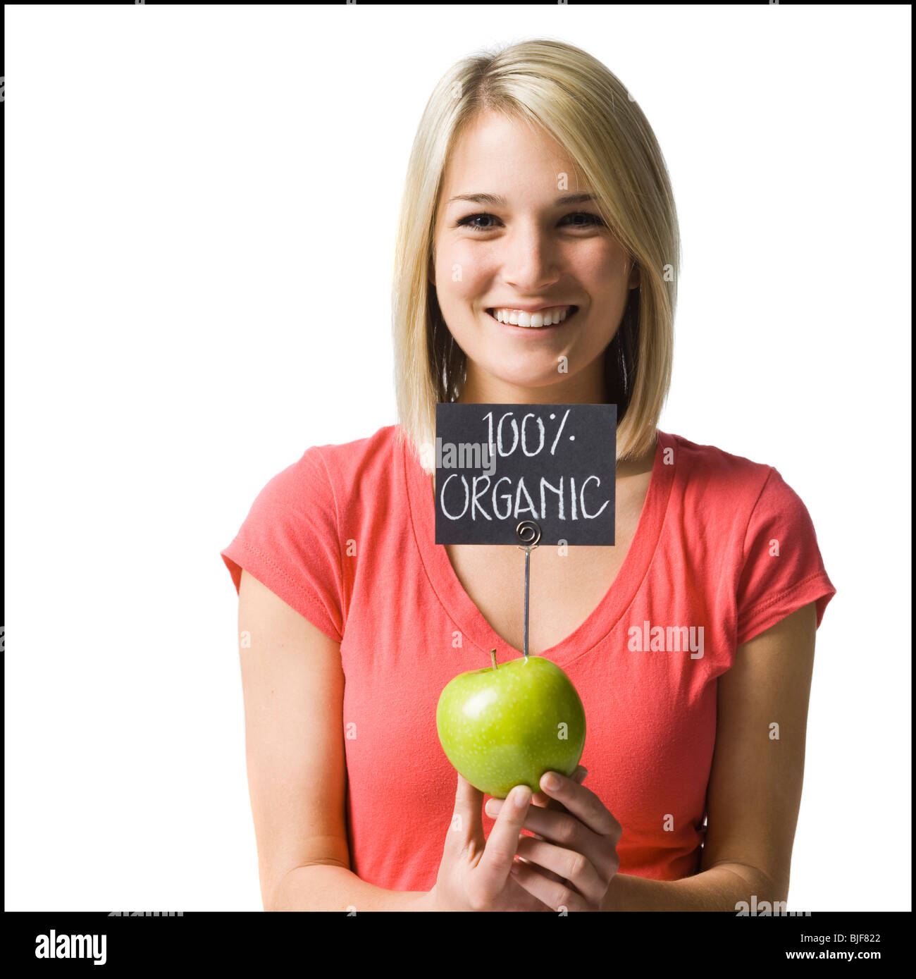 Donna con un organico di Apple Foto Stock