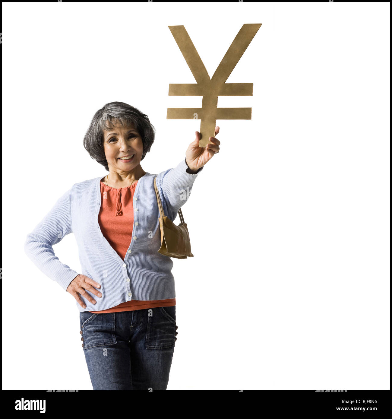 Donna che mantiene il simbolo di valuta Foto Stock