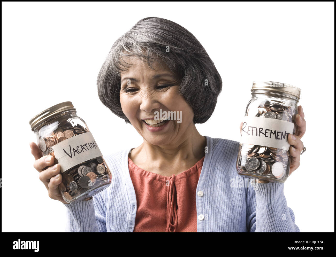 Donna con due vasetti di monete Foto Stock