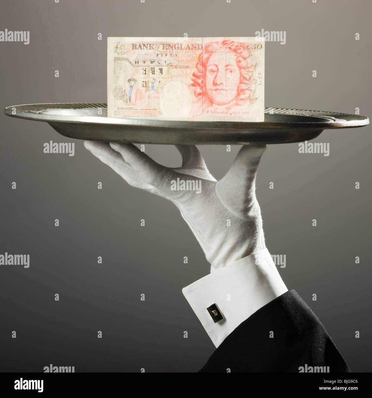 Sterlina britannica su un vassoio Foto Stock