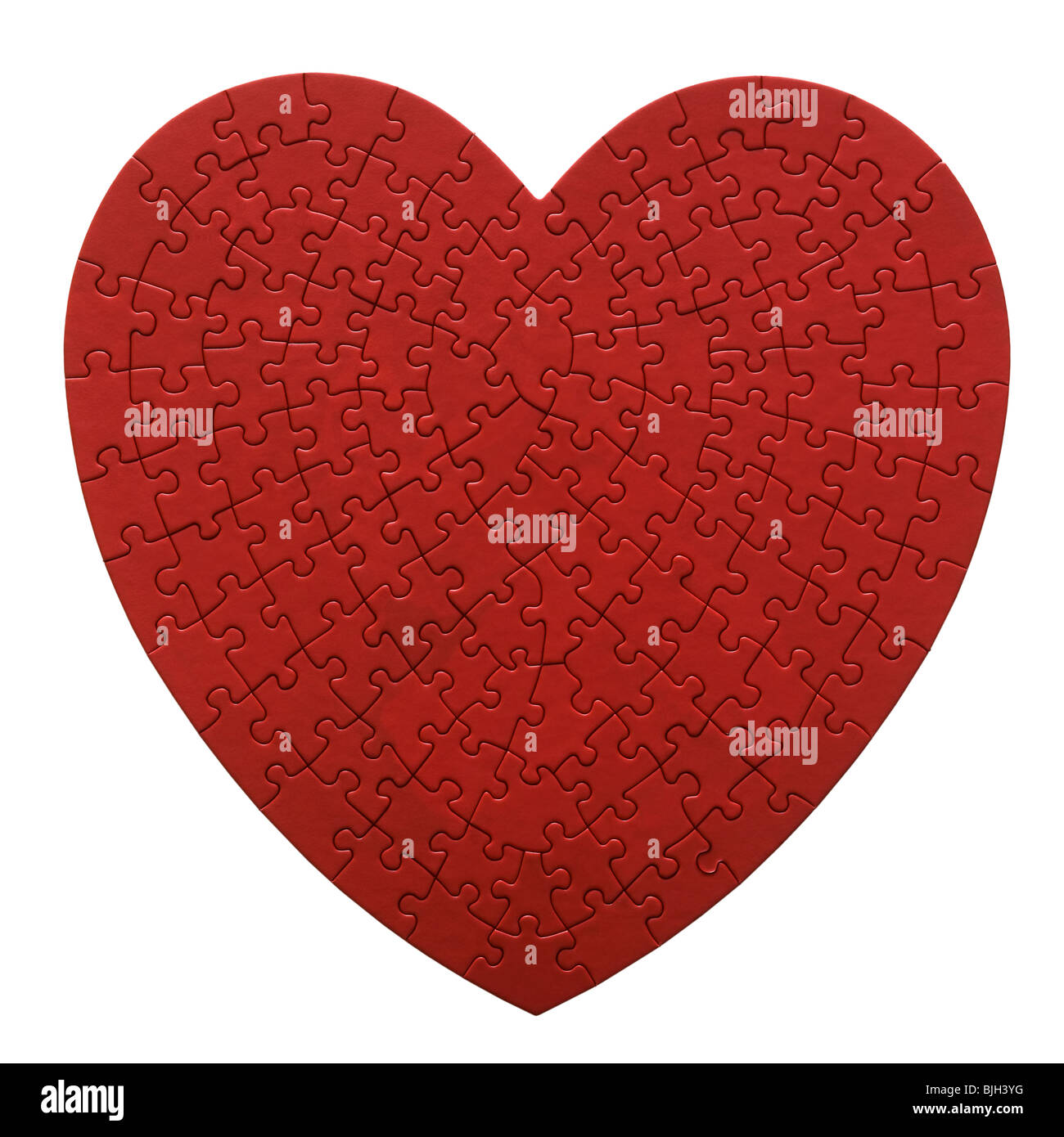 Rosso a forma di cuore puzzle su sfondo bianco Foto Stock
