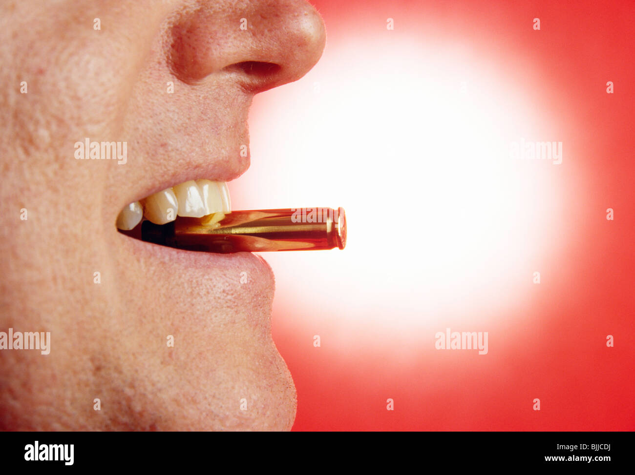 L'uomo "mordere il Bullet' Foto Stock