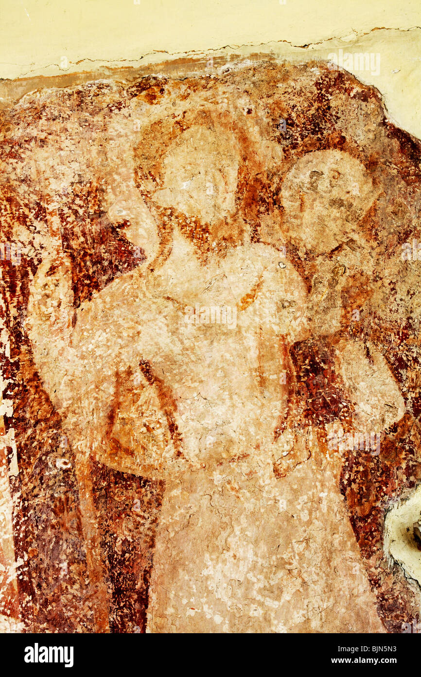Pittura murale medioevale raffigurante San Cristoforo che porta Cristo, Chiesa di Tutti i Santi, Crostwight, Norfolk Foto Stock