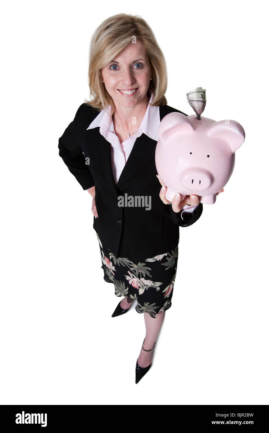 Imprenditrice tenendo un salvadanaio Foto Stock
