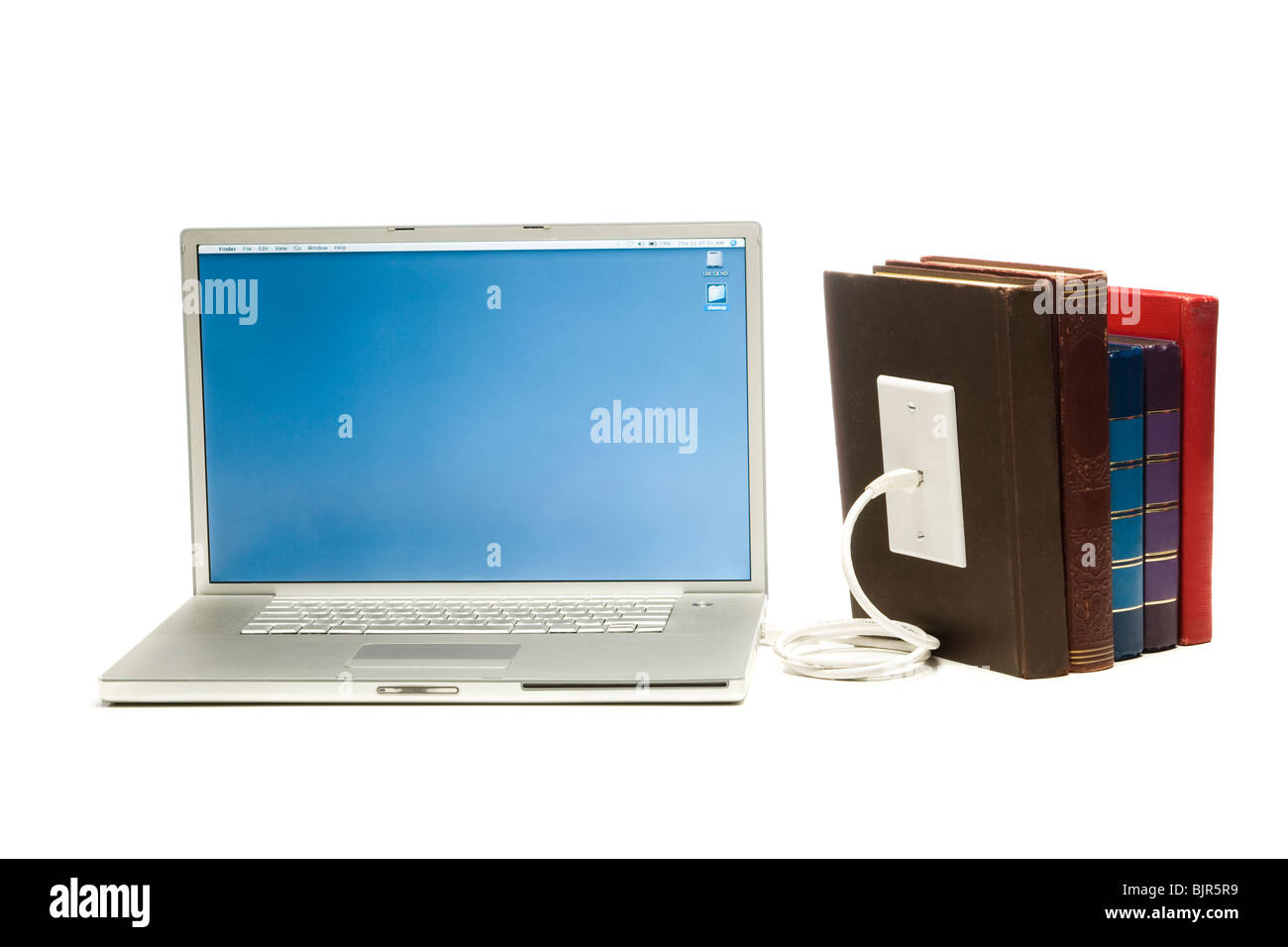 Computer portatile inserito in libri Foto Stock