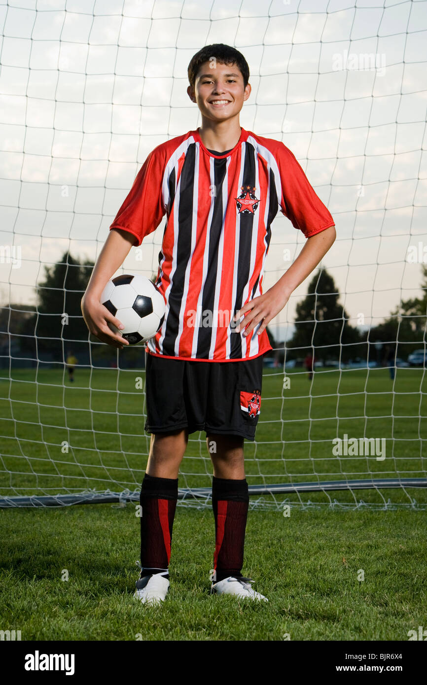 Giovane giocatore di calcio Foto Stock