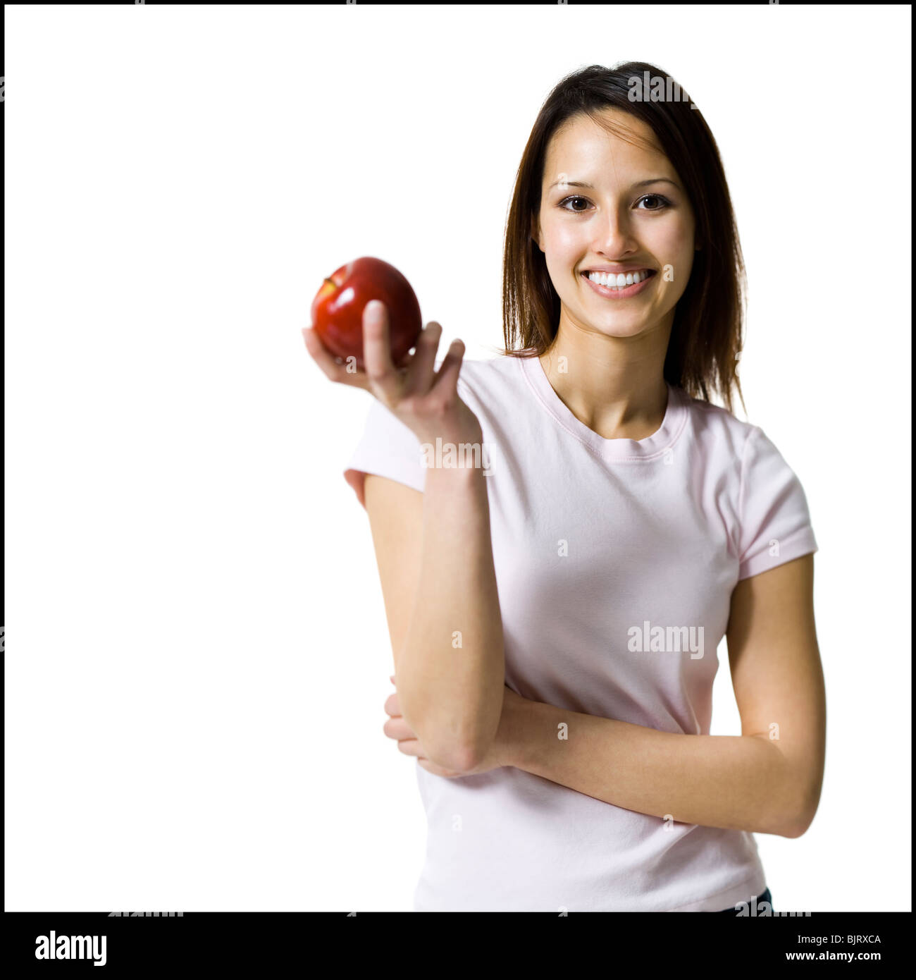 Donna che mantiene un rosso apple Foto Stock