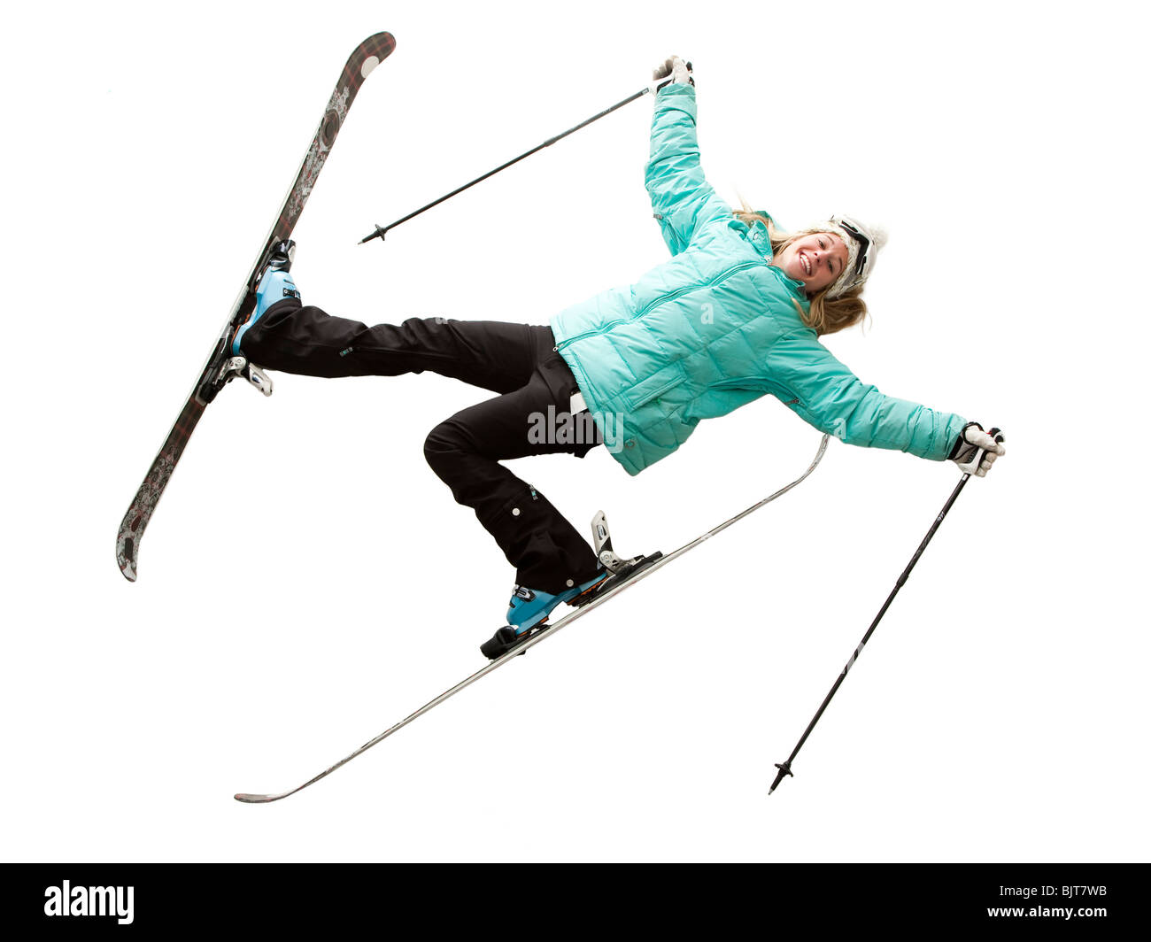 Ritratto di giovane donna in skiwear, sdraiato Foto Stock
