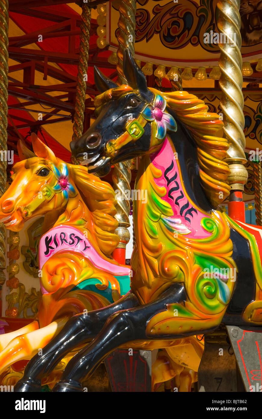 Giostra pony su una fiera ride, Liverpool, in Inghilterra, Regno Unito Foto Stock