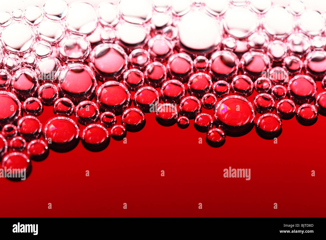 Abstract il vino rosso bolle, close up shot Foto Stock